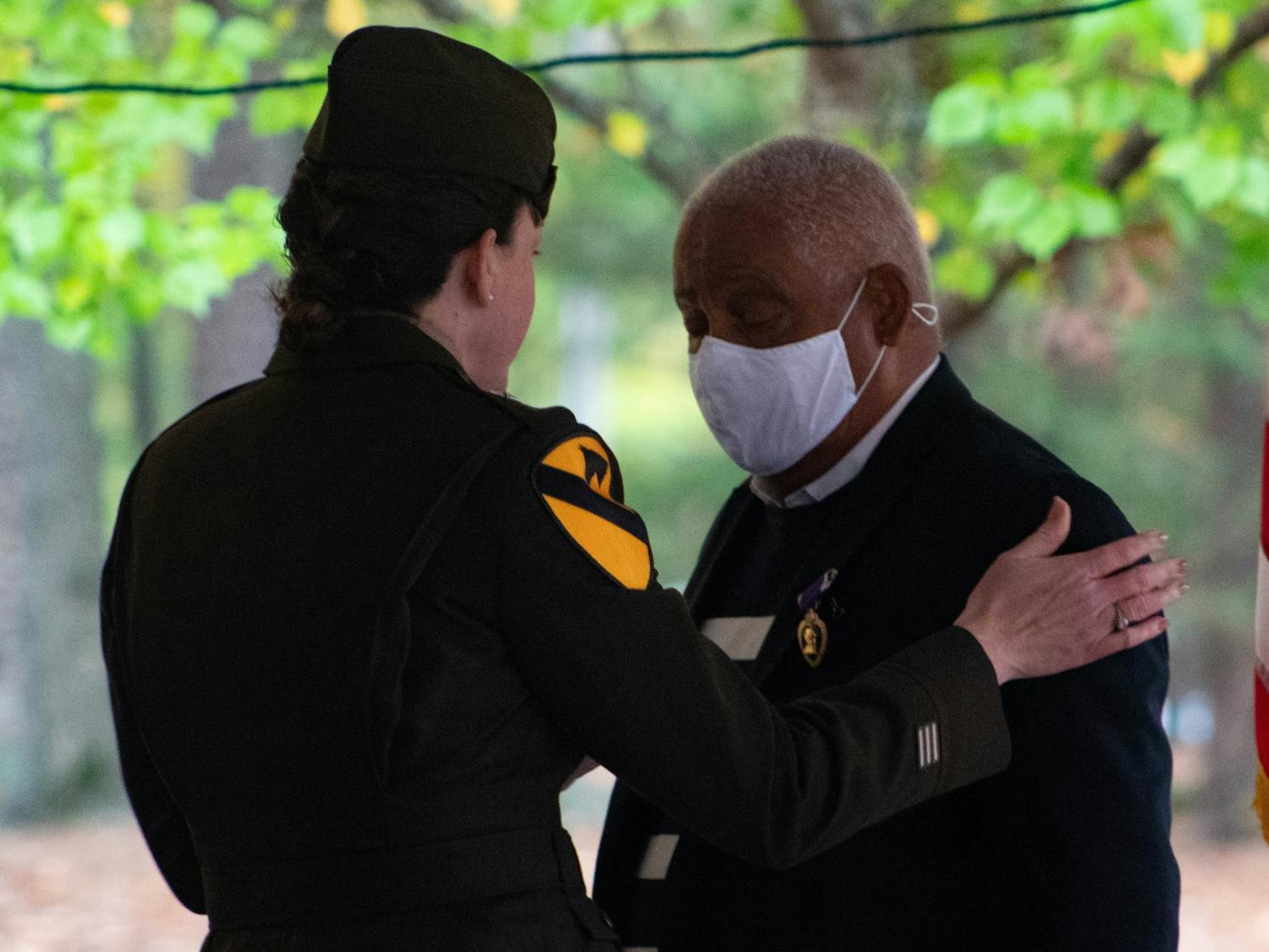 Army Brigadier General Alison C. Martin presents the Purple Heart to Vietnam War veteran John Spencer 51 years after his service, on Nov. 4. Spencer was denied the Purple Heart and other medals until the Military and Veterans Law Clinic at UNC took his case.