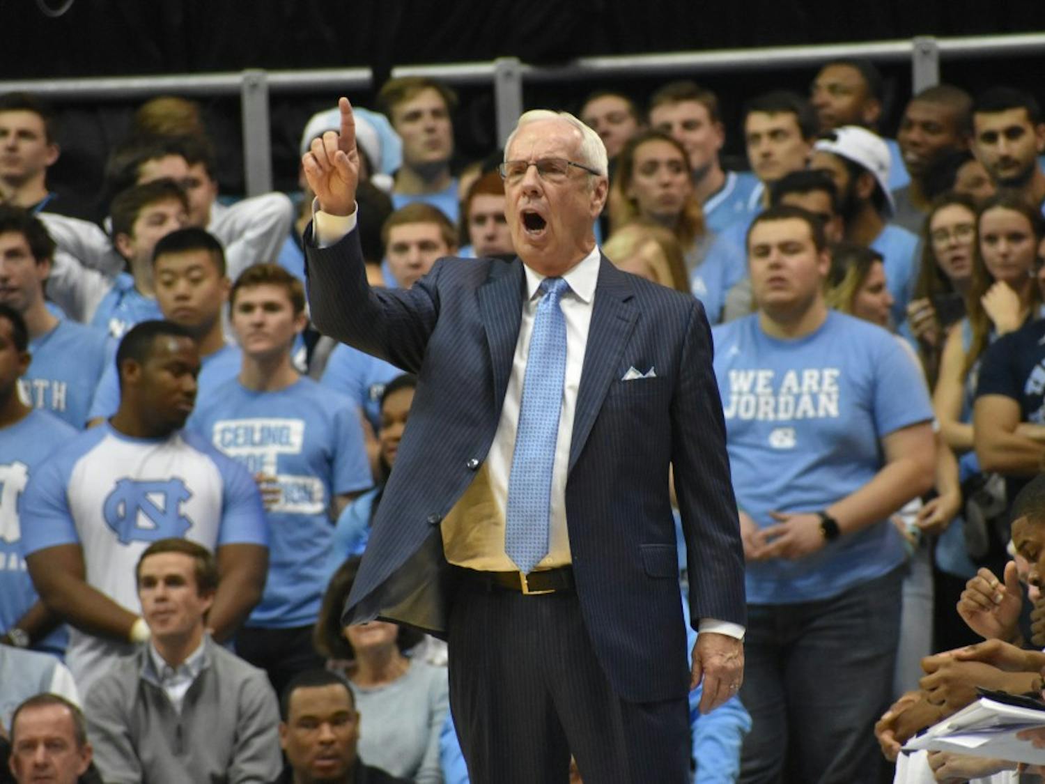 Men's basketball head coach Roy Williams yells from the sideline against Michigan on Nov. 29 in the Smith Center.