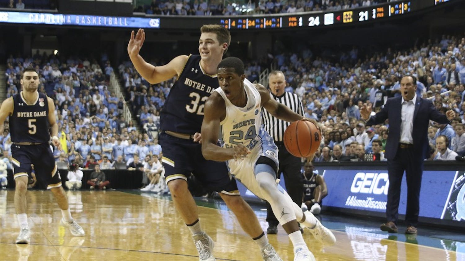 UNC guard Kenny Williams (24) drives in the lane against Notre Dame in Greensboro on Sunday.