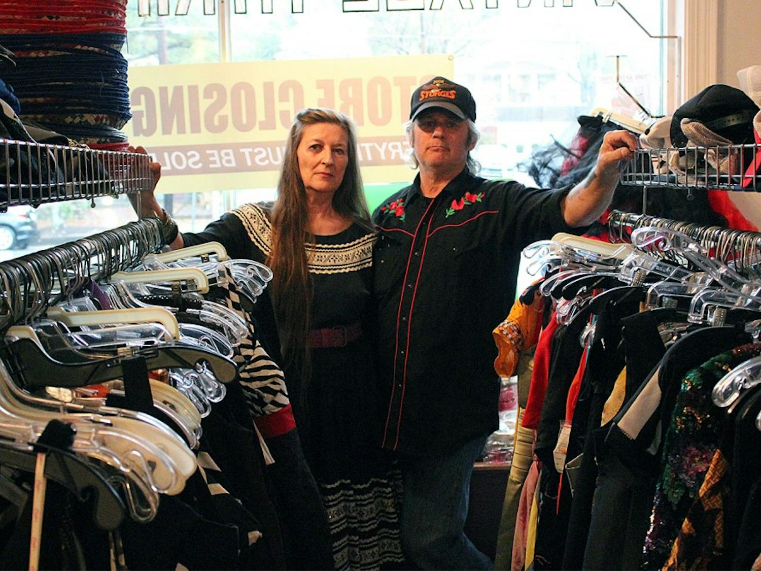 Ann Jackson (left) and Steven Schrenzel, owners of the vintage thrift shop Time after Time, locked the doors to the store for the last time Tuesday. 