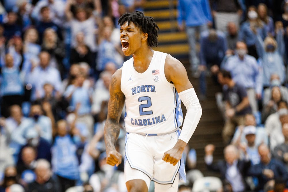 UNC sophomore guard Caleb Love (2) celebrates a three-pointer during a men's basketball game against Syracuse on Monday, Feb. 28, 2022, at the Dean Smith Center. UNC won 88-79.