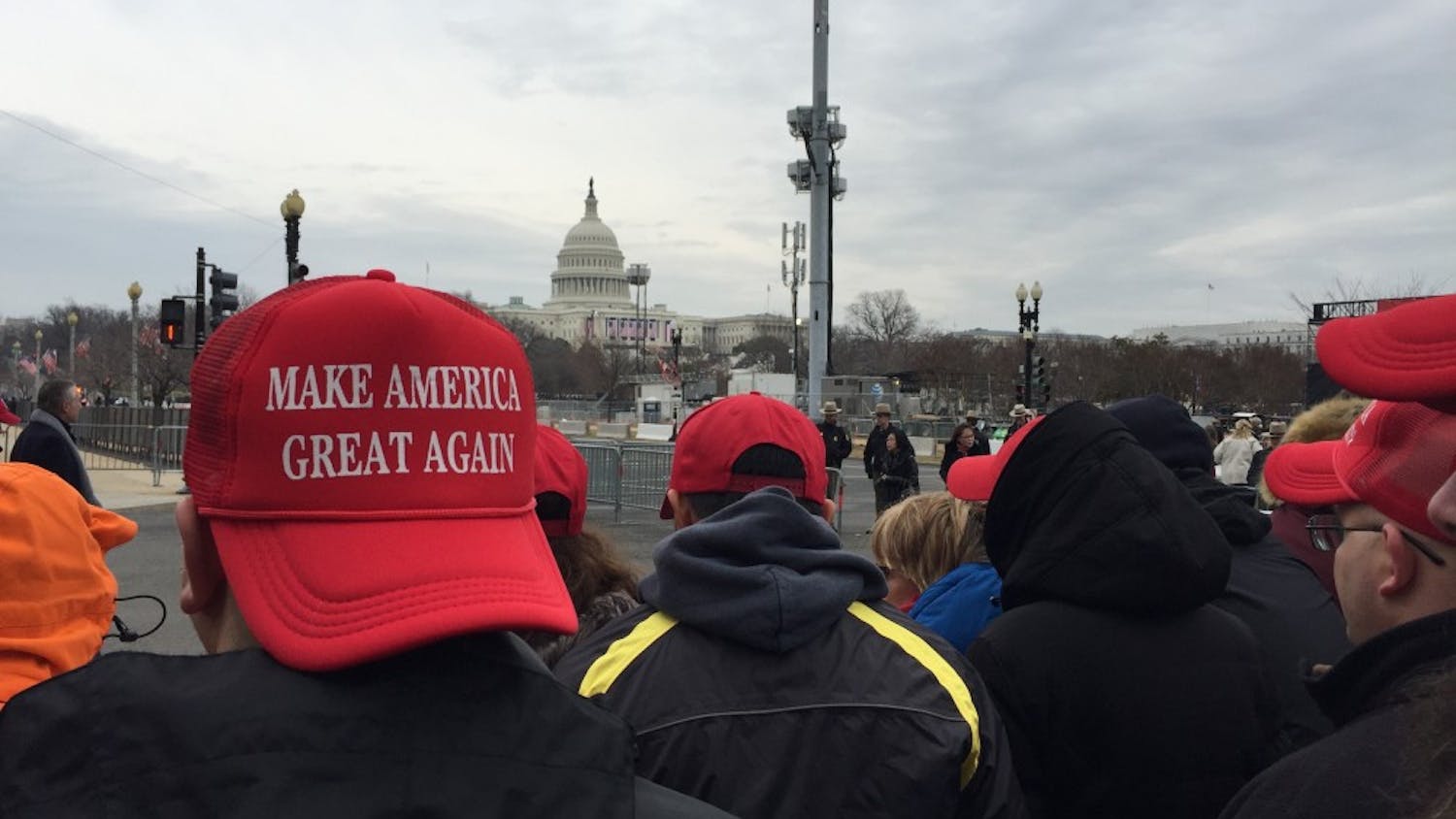 Trump supporters don "Make America Great Again" hats in the moments leading up to the president's inauguration.&nbsp;