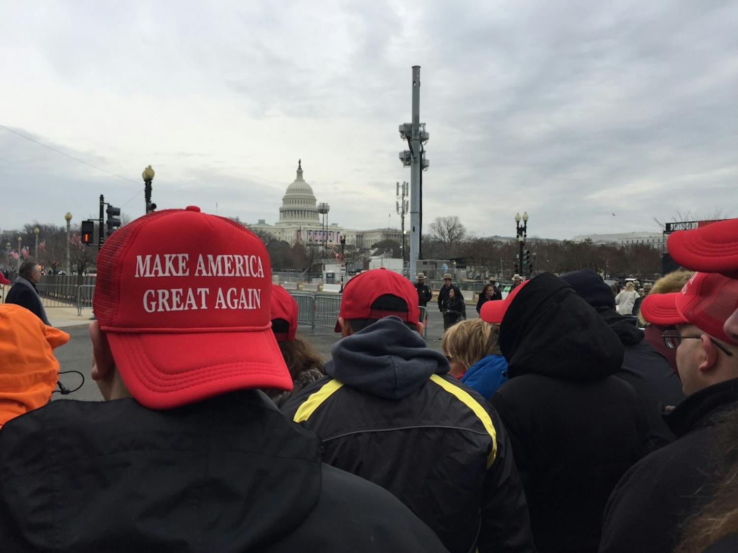 Trump supporters don "Make America Great Again" hats in the moments leading up to the president's inauguration.&nbsp;