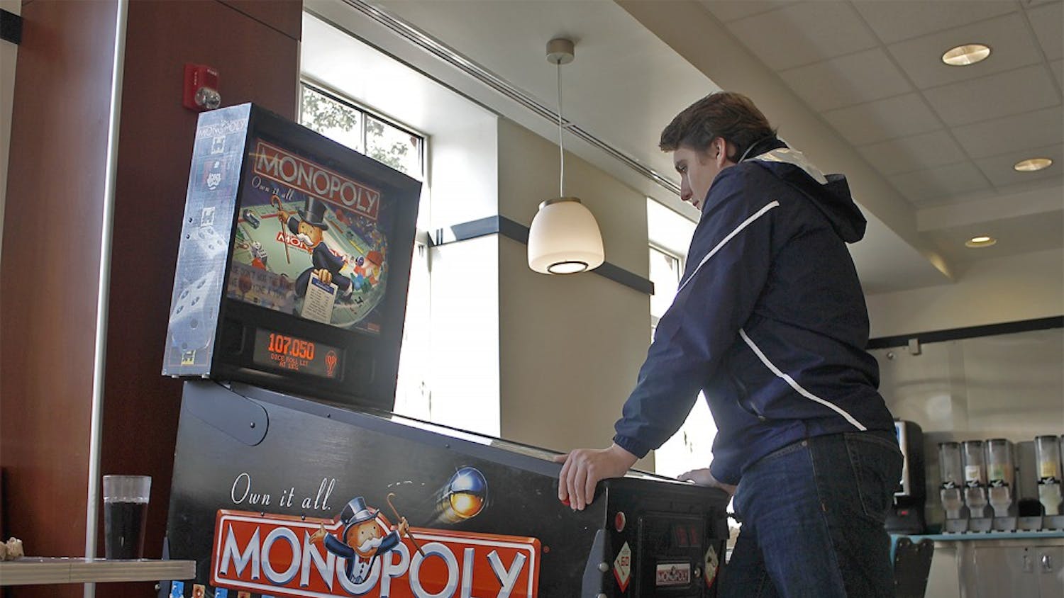 Conor Whitlark, a freshman from Greenville, NC enjoyed a game of Monopoly pinball in the Rams Head dining hall on Thursday afternoon.  Although he said he is better at the Galaxy arcade game, his favorite is the pin ball machine.