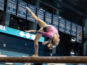 First-year Elizabeth Culton performs her beam routine during the gymnastics meet against the University of New Hampshire in Carmichael Arena on Monday, Feb. 17, 2020. The Tar Heels placed first against the Wildcats.