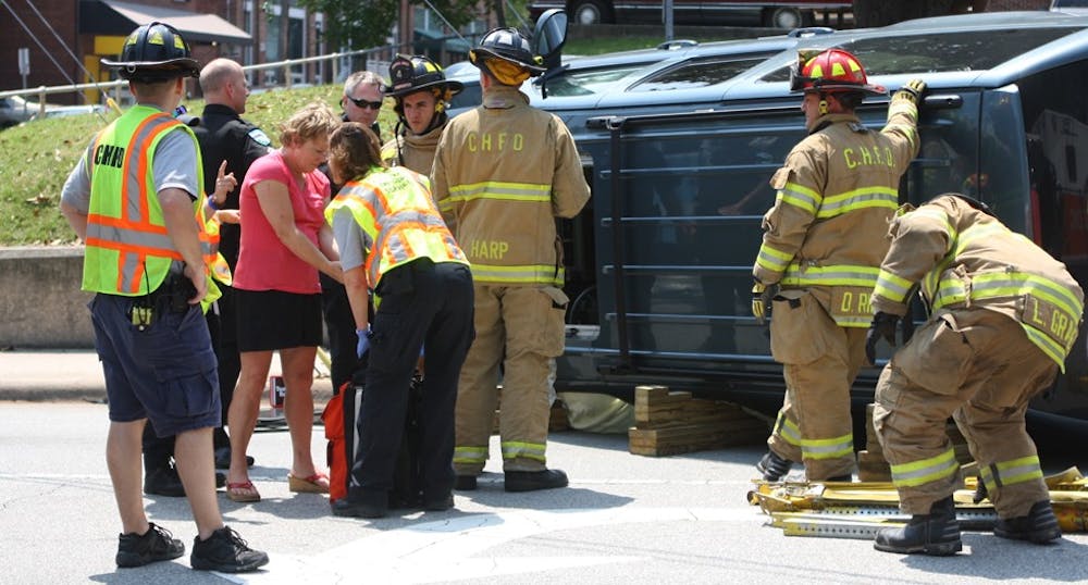 Photo: Woman in flipped car on Rosemary Street charged with DWI (Erin Hull)