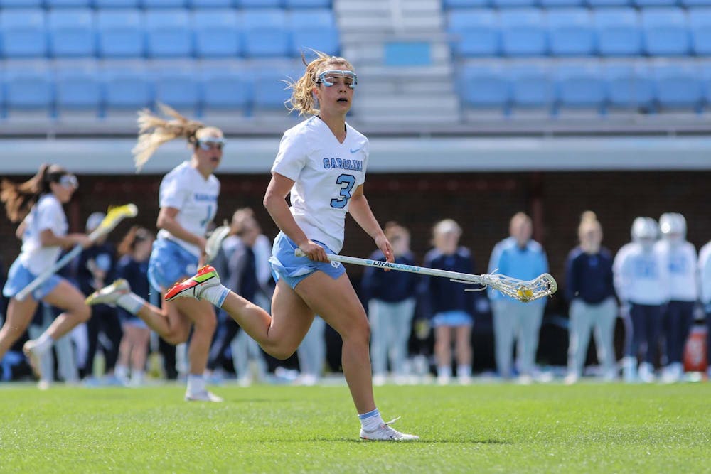 <p>DTH File. UNC fifth-year attacker Jamie Ortega (3) carries the ball downfield against Virginia Tech on Saturday, March 26, 2022, at Dorrance Field. UNC won 20-8.</p>