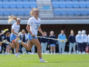 DTH File. UNC fifth-year attacker Jamie Ortega (3) carries the ball downfield against Virginia Tech on Saturday, March 26, 2022, at Dorrance Field. UNC won 20-8.