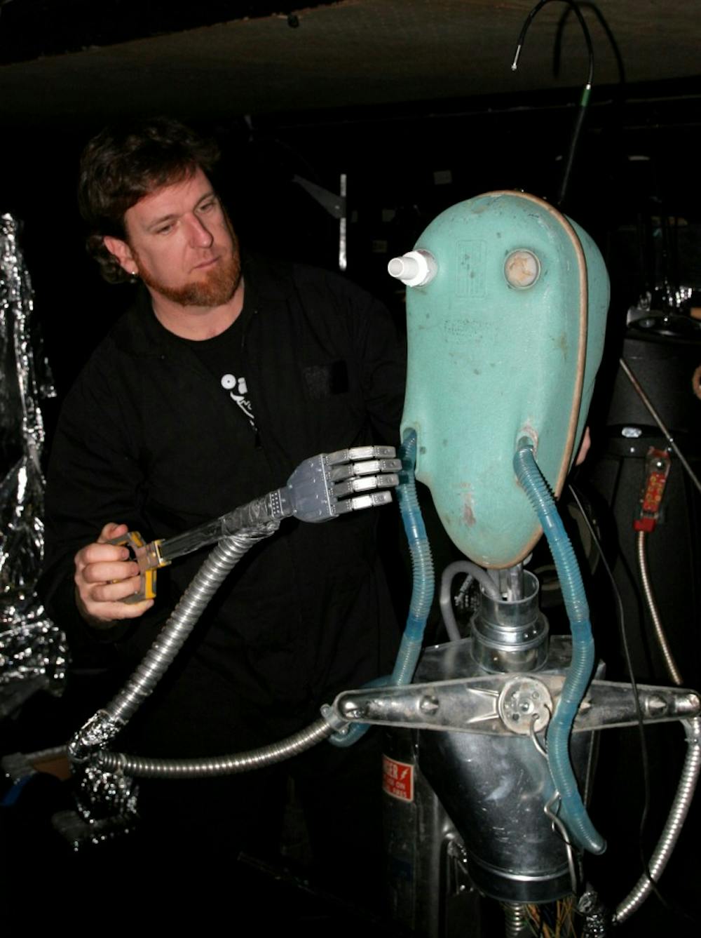 Donovan Zimmerman shows off one of the robot puppet used in the PPI’s new show. DTH/Benn Wineka