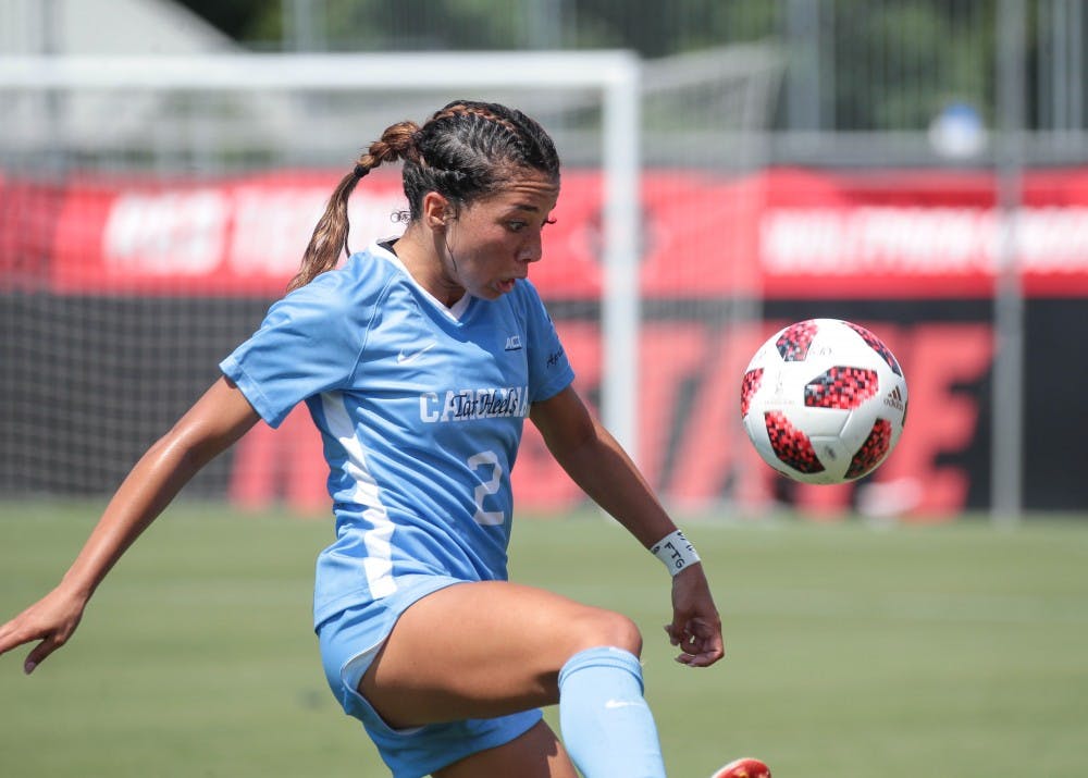 <p>Sophomore forward Sydney Spruill juggles the ball in UNC's 3-2 exhibition win over N.C. State on Aug. 9 in Raleigh.</p>