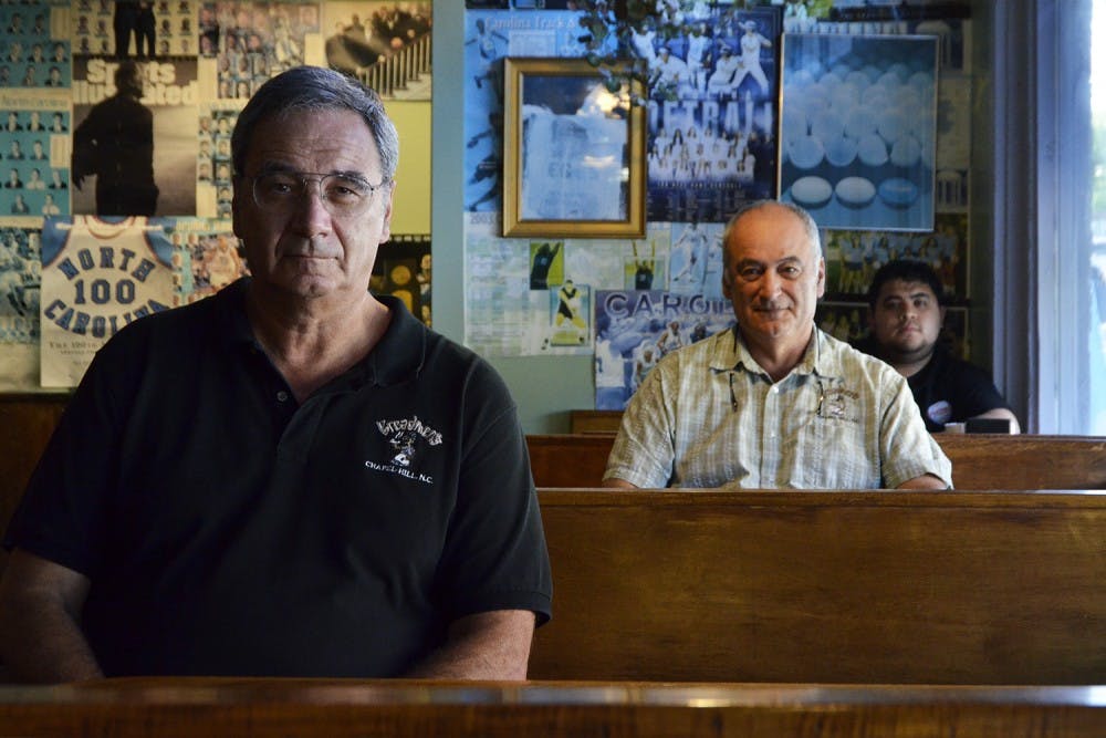 Breadmen's owners Roy Piscatello and Bill Piscatello sit with Omar Castro, who will take over as the new manager of the restaurant.