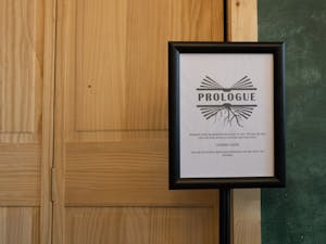 A sign advertising the opening of Prologue sits inside of the Epilogue book cafe on Sunday, April 24, 2022. Visitors of Epilogue can see a glimpse of Prologue as it undergoes its construction.