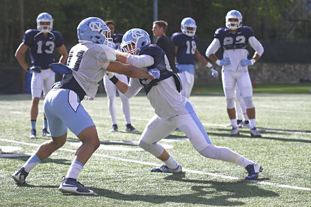 First year Myles Wolfolk and face off during spring practice Thursday afternoon. 