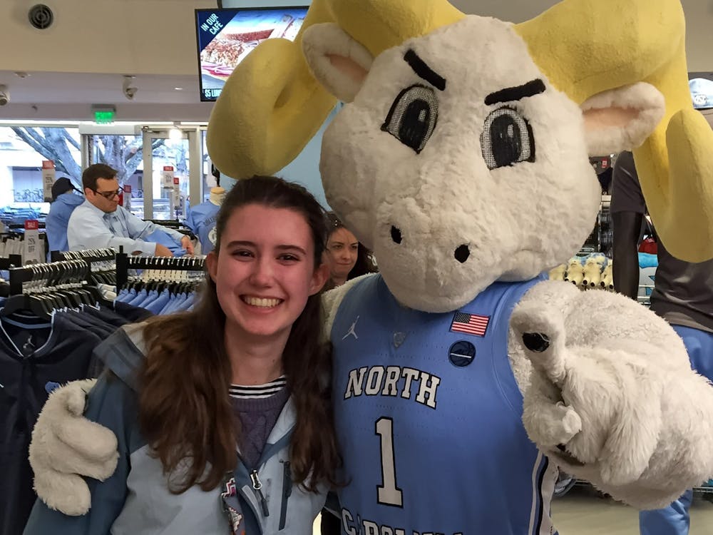 <p>Daily Tar Heel Community Engagement Director Elizabeth Egan poses with Rameses in the UNC Student Stores during a visit to UNC's campus when she was 17, on March 8, 2019.</p>
<p>Photo Courtesy of Elizabeth Egan.</p>