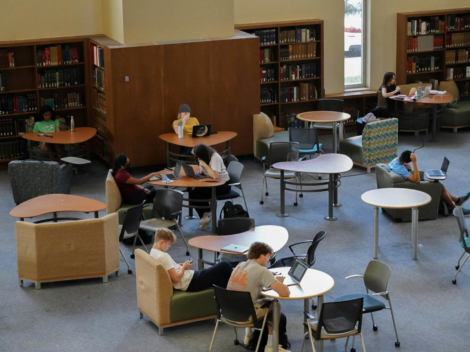 Students are studying in the library for their future tests.