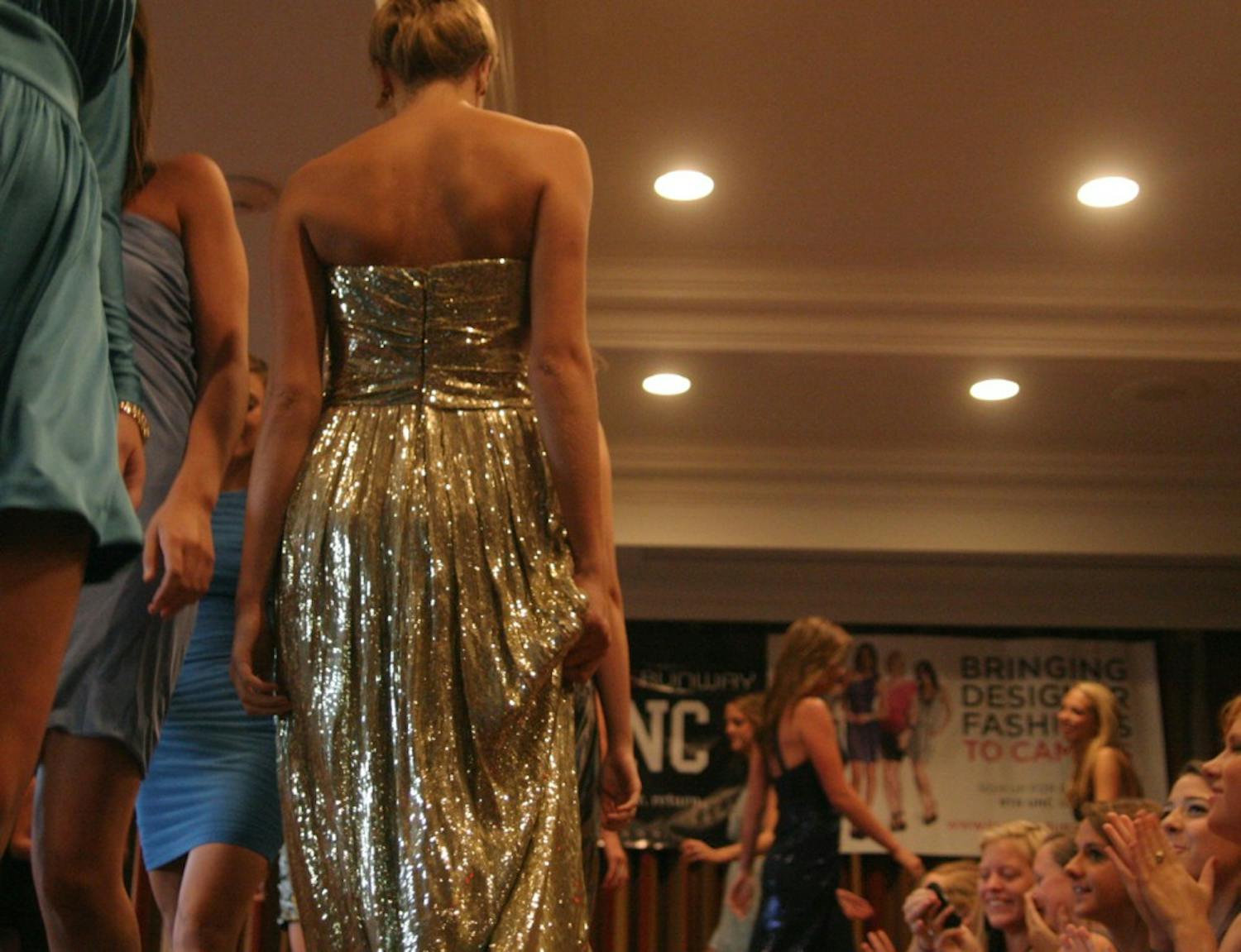 Models showcase dresses during the final walk at the No Booze, No Boys Fashion Show. “For every event at UNC, every girl should be wearing a different, fabulous dress,” Rent the Runway co-founder Jenn Hyman said. Women were able rent dresses featured in the show.