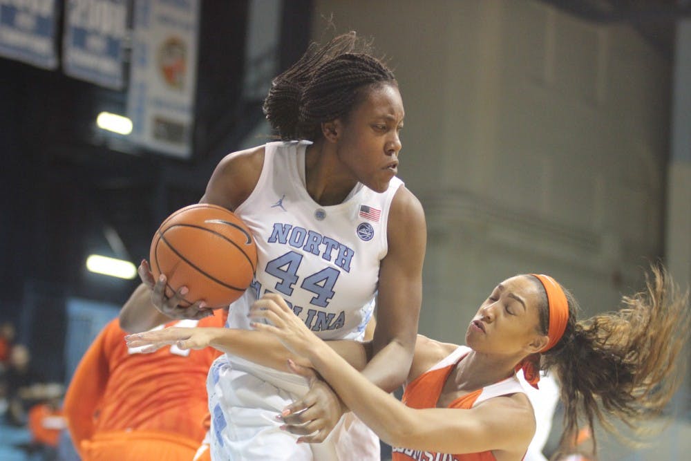 <p>Forward Janelle Bailey (44) snags a rebound during Thursday night's game against Clemson in Carmichael Arena.&nbsp;</p>