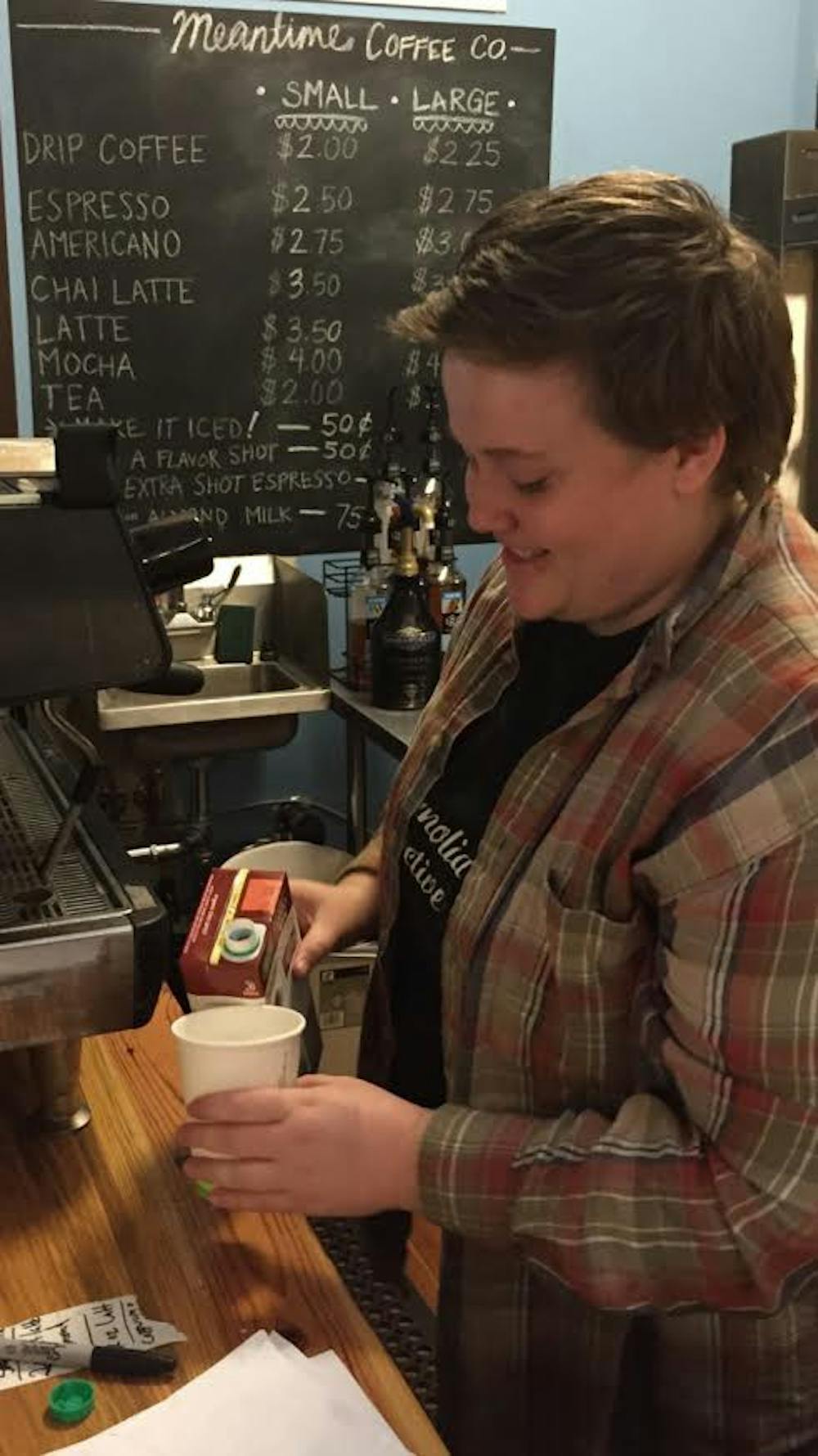 Hannah Hodge, 20, a junior&nbsp;women's and gender studies major, was making a customer's coffee at the Meantime Cafe.&nbsp;