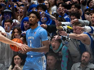 UNC graduate forward Leaky Black (1) focuses before an inbound, as Cameron Crazies reach in to distract Black during the men's basketball game against Duke on Feb. 4, 2023 at Cameron Indoor Stadium. UNC lost 63-57.