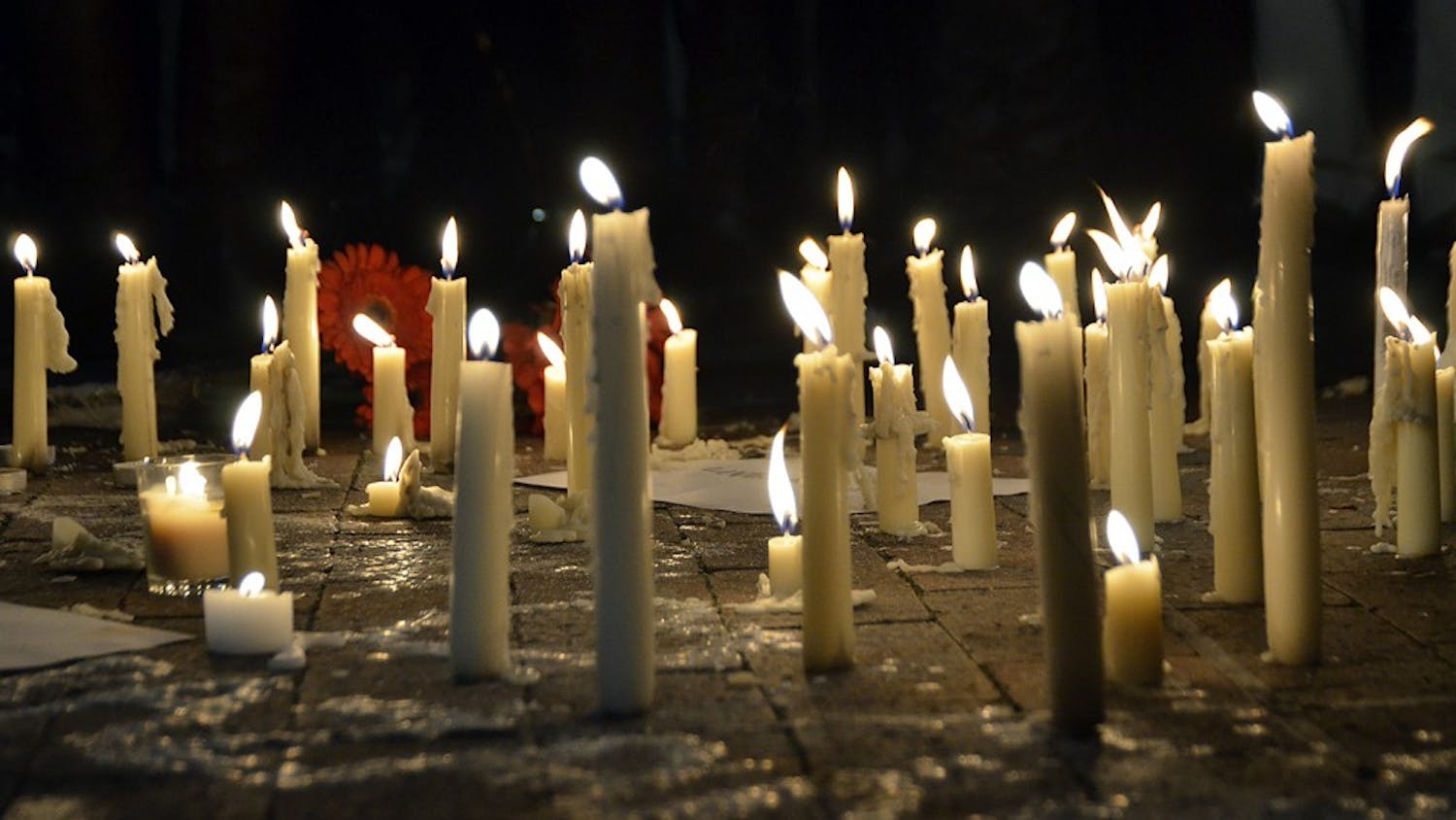 File photo/Candles burning at a vigil.&nbsp;