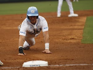 UNC baseball junior and 1B, Michael Busch, prepares slides into third base during the Tar Heel's first game in the regional championship versus UNCW on Friday May 31, 2019. UNC won 7-6. 