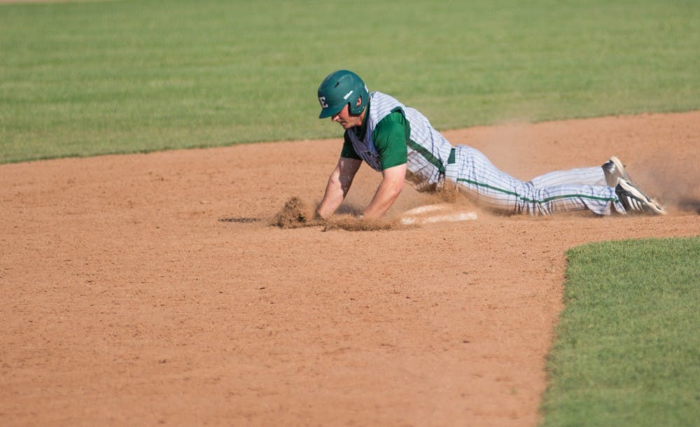 Ty Gilmore slides into second in the ninth inning during the Eastern Michigan vs. Ohio University baseball game at Ohio University in Athens, Ohio on Saturday, April 26, 2014.