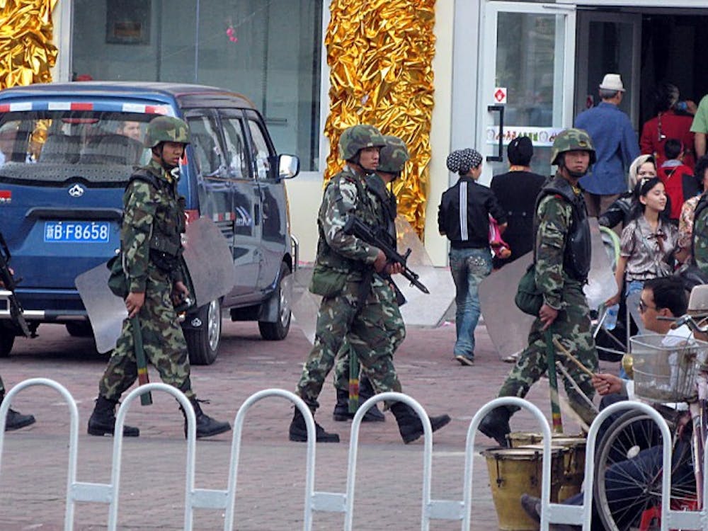 Chinese troops patrol in a Uighur neighborhood in Urumqi, China, September 16, 2009. a city hit hard by riots this summer and violent protests earlier this month. (Tom Lasseter/MCT)
