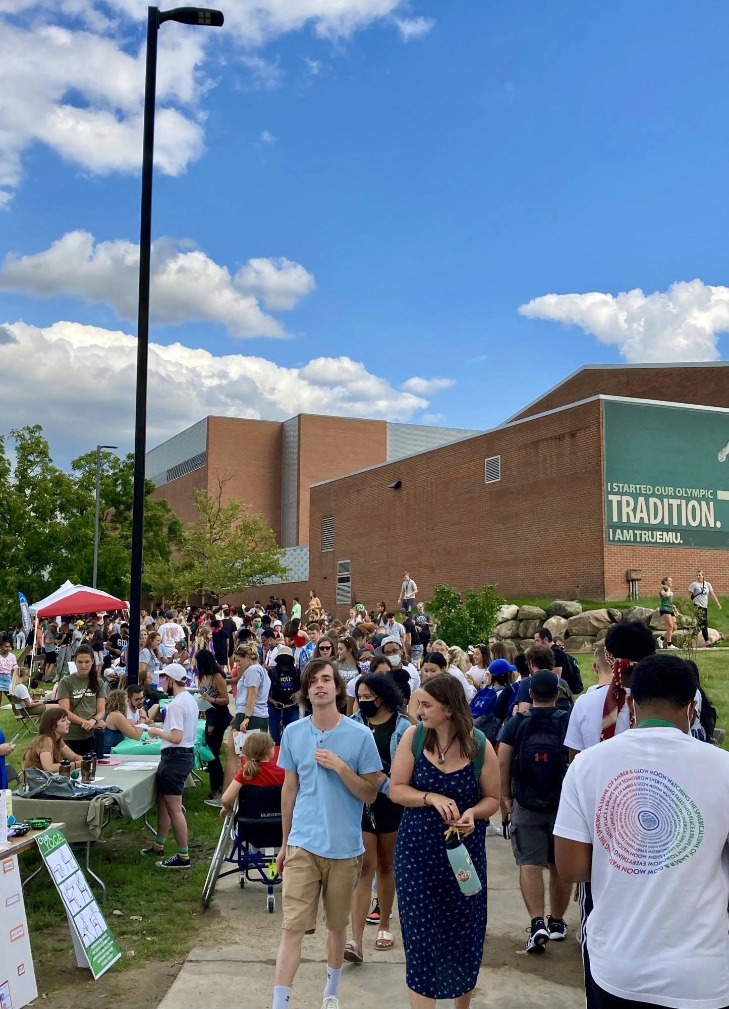 A crowd of students stopping at the tables of different student organizations and clubs at EagleFest