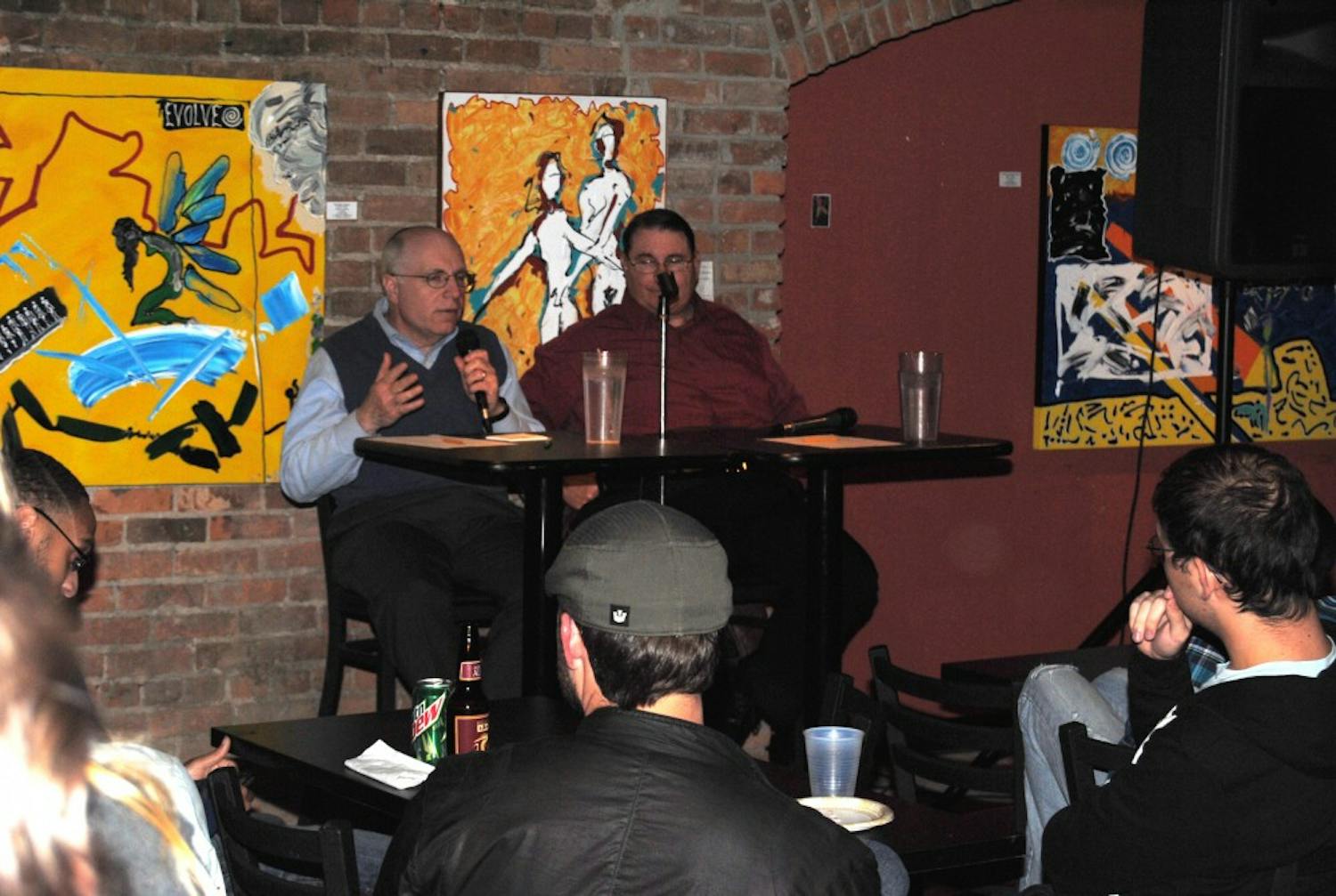 Rabbi Robert Dobrusin (left) and newcomer Father Phil Mayfield (right) hold a conversation comparing Judaism and Catholicism at the Keystone Underground Lounge Thursday. 