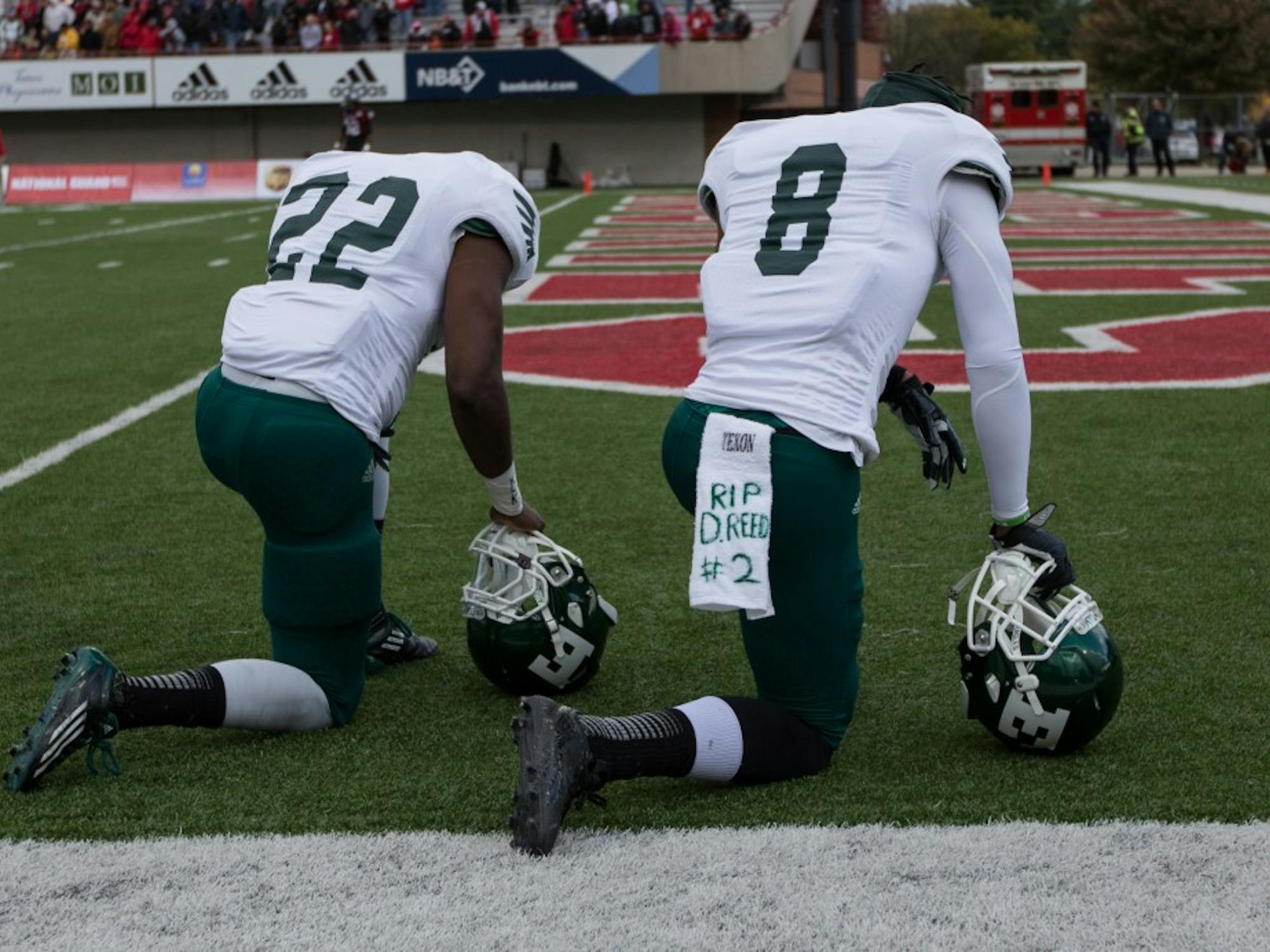 Eastern Michigan players Ryan Brumfield and Quincy Jones take a moment to reflect on the events of the past week before EMU took on Northern Illinois Saturday in Dekalb the day after the team went to Demarius Reeds visitation service in Chicago.
