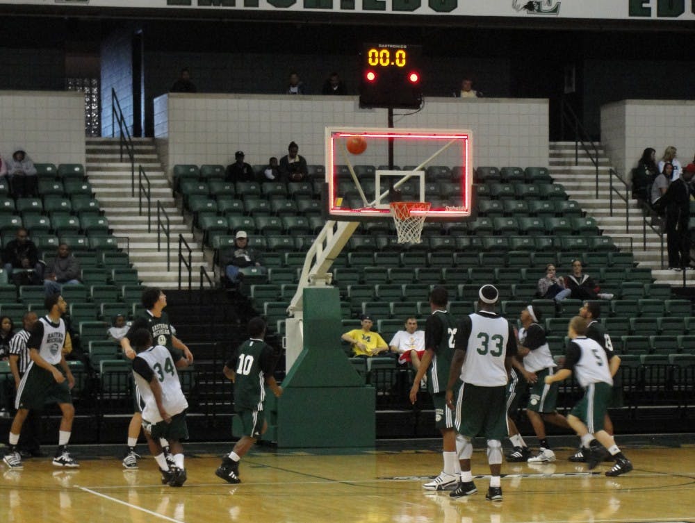 EMU men's basketball green and white