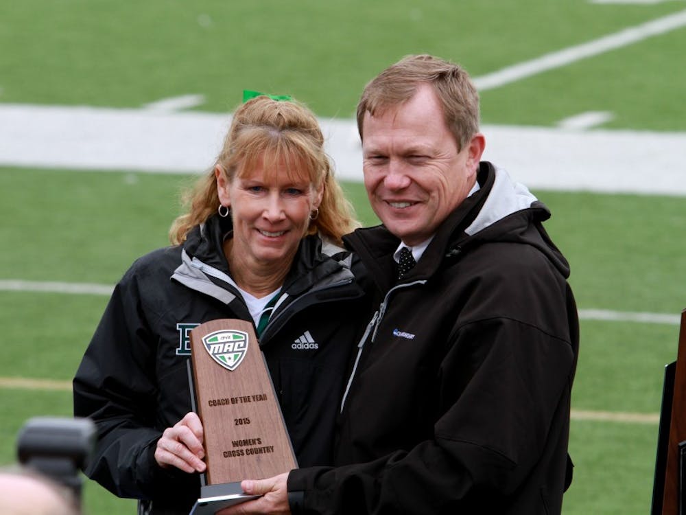 Coach Parks receives the Coach of the Year award in the MAC Cross Country Championships in Canton, Ohio on Saturday, October 31, 2015.  