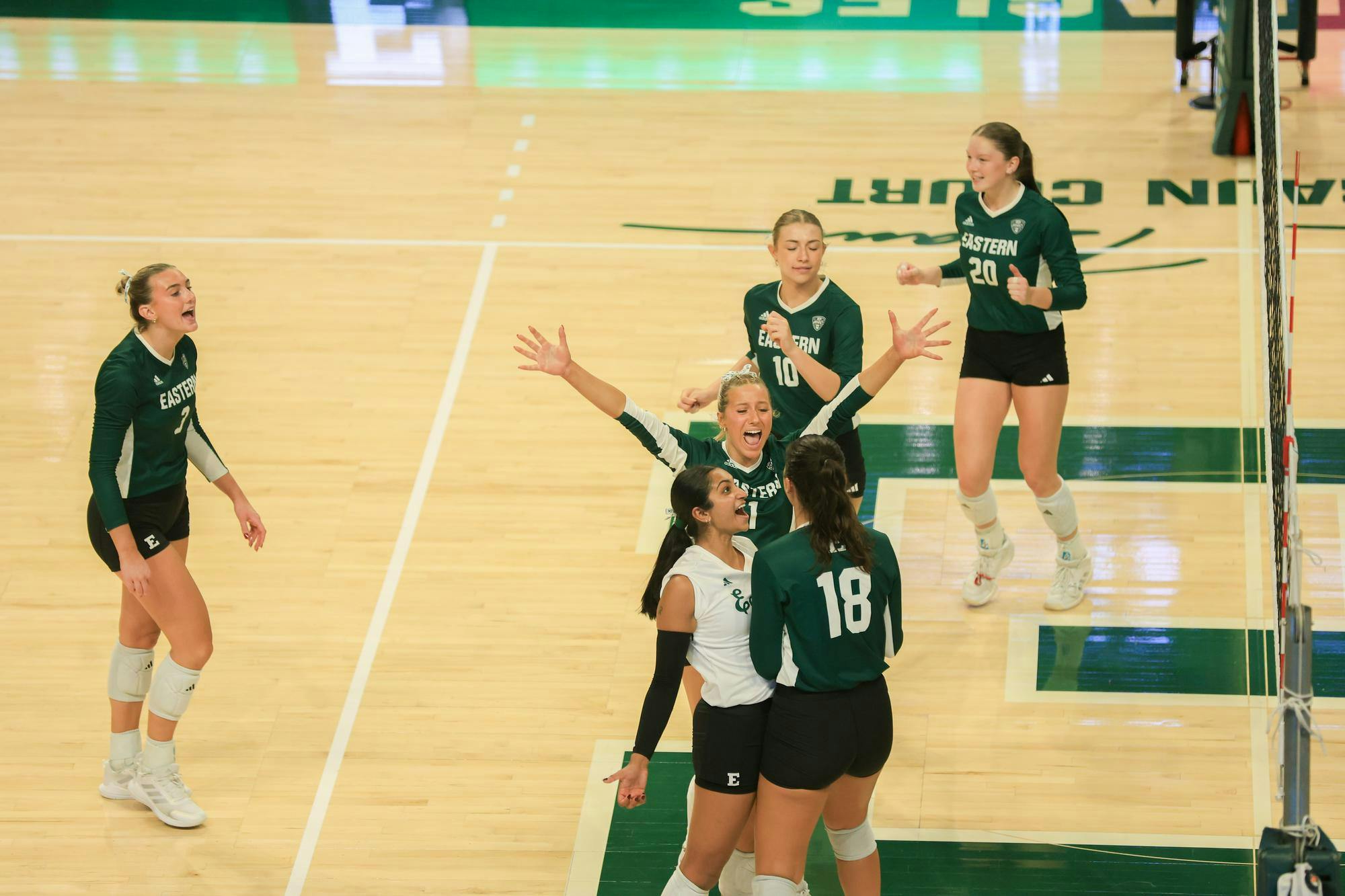Eastern Michigan volleyball players celebrate