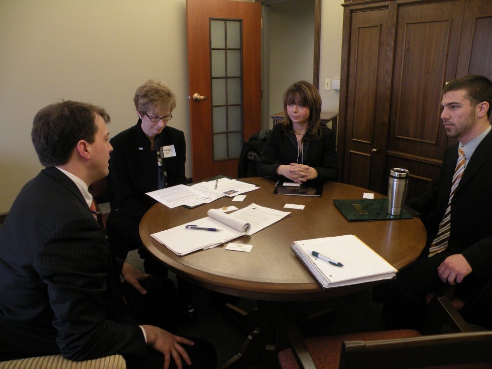 	Students, faculty and alumni of Eastern Michigan University meet with state representatives about higher education budget concerns.