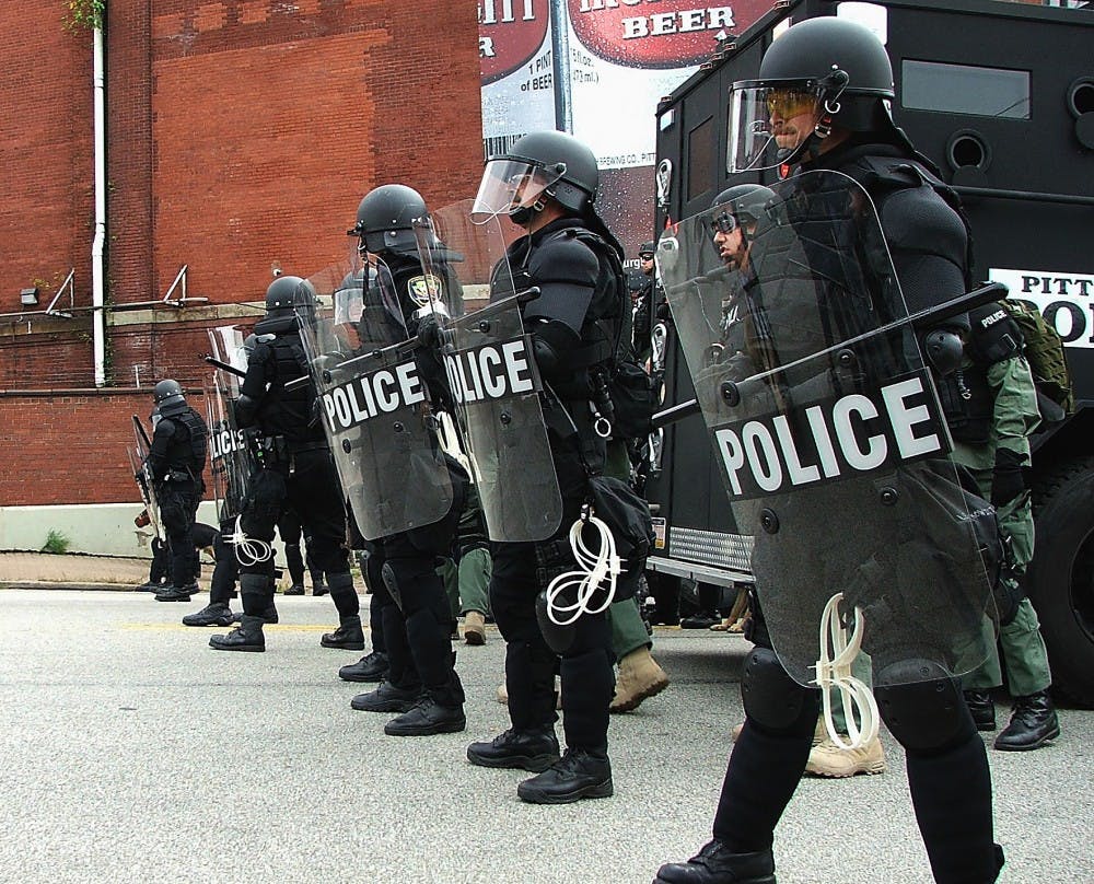 Riot police line up to stop an unauthorized, yet peaceful march.