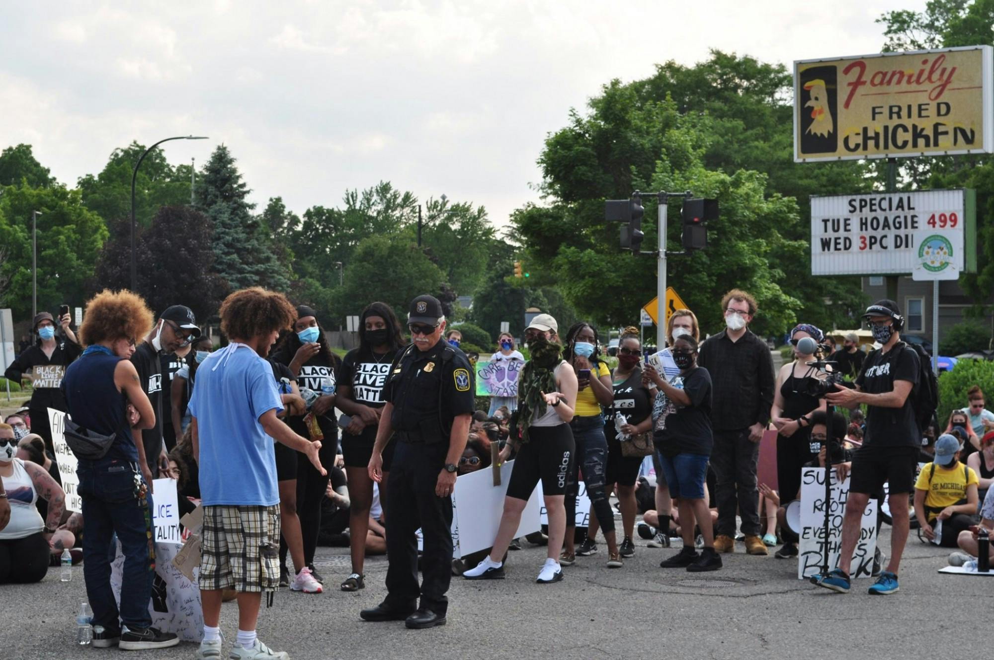 Protestors speak Ypsilanti Chief of Police Tony DeGiusti Saturday, June 20, 2020.