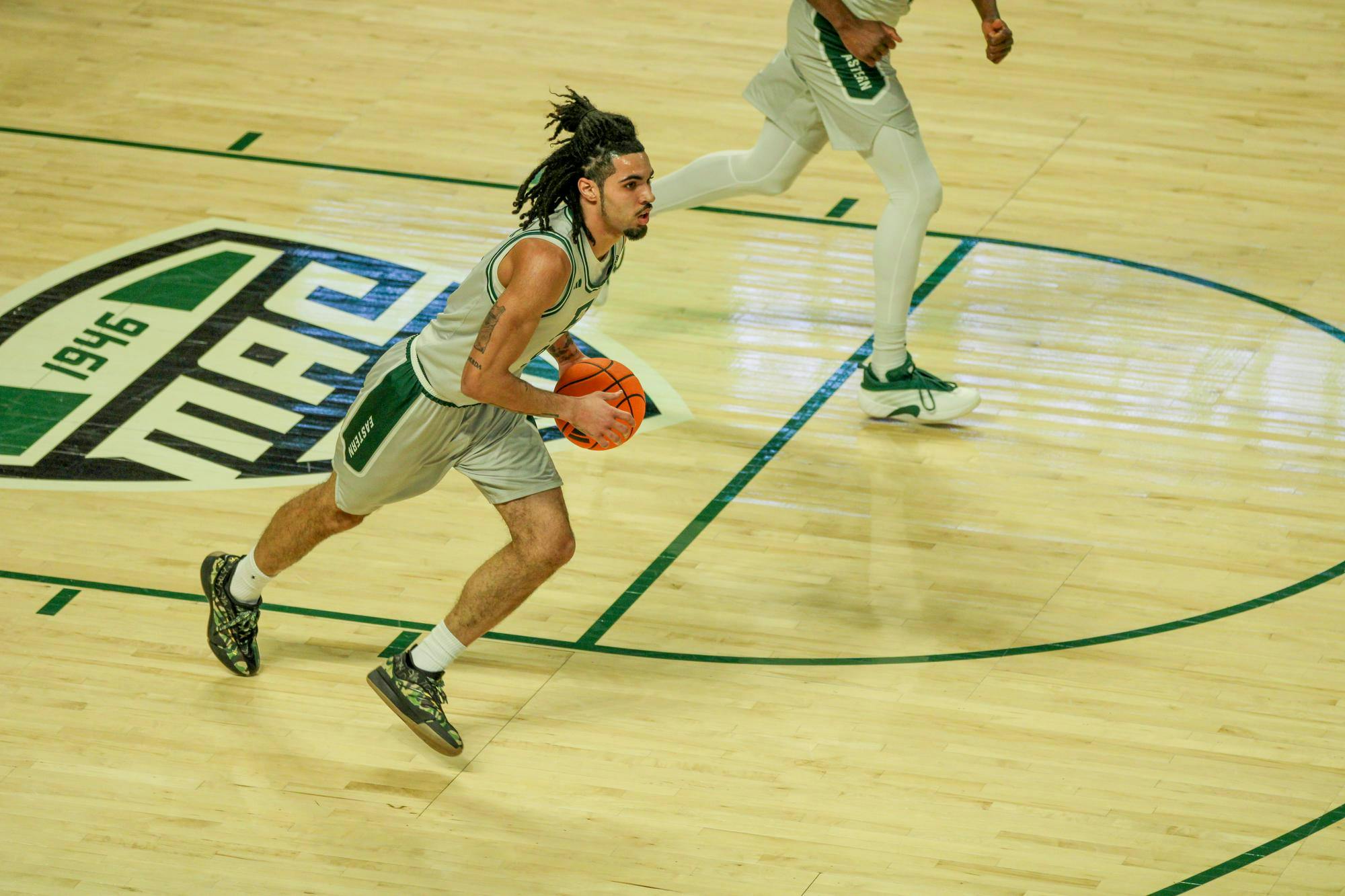 Eastern's #9 Patterson bringing the ball down the court. 