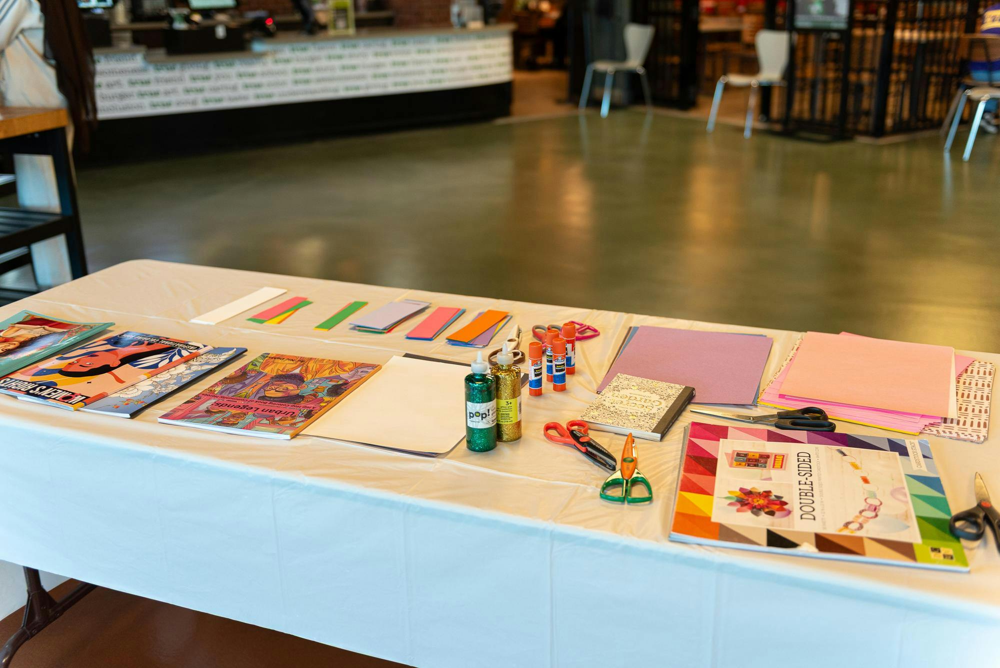 Craft materials are laid out on a table in the Student Center.