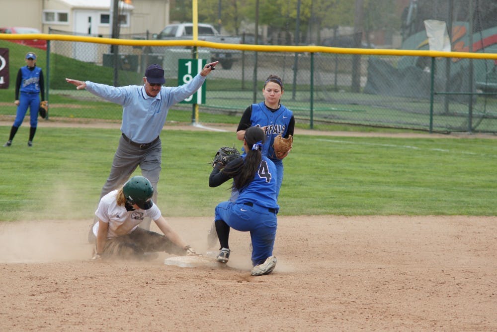 	A runner for the Eagles slides to safety during a game against the Buffalo Bills on Friday.