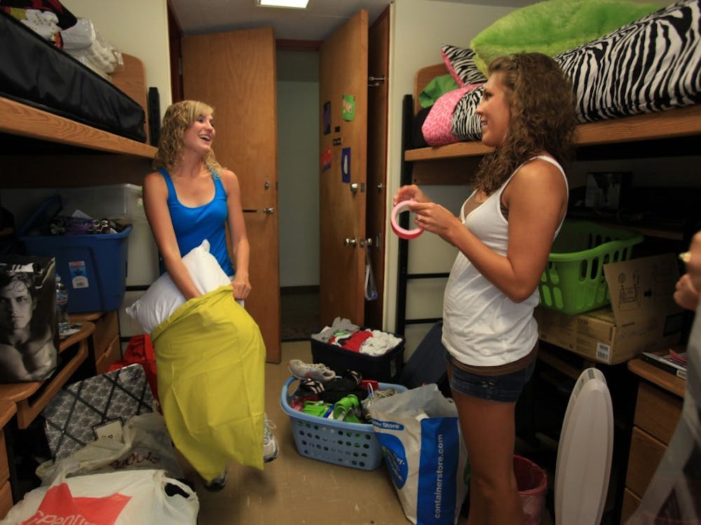 Danielle Sterczek, 18, of Palatine, Ill., left, and her roommate Krysten Karns, 18, of Aledo, Ill., meet for the first time in person as they move into their dorm room in Florida Avenue Residences at University of Illinois Urbana-Champaign, on Aug. 18, 2009. The two had met each other on Facebook before meeting at the dorm. (Nancy Stone/Chicago Tribune/MCT)
