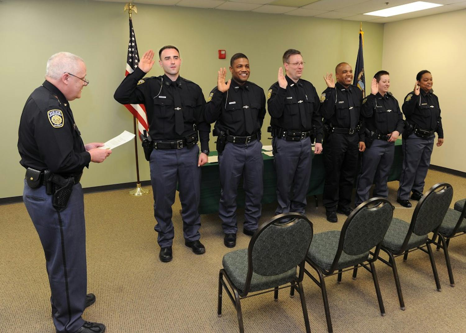 EMU Cheif Heighes swears in 6 new officers.