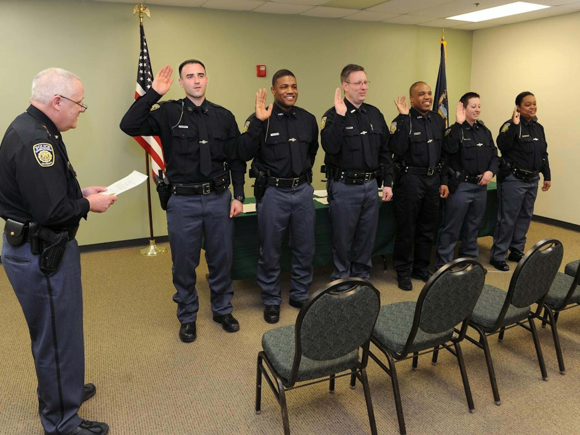 EMU Cheif Heighes swears in 6 new officers.