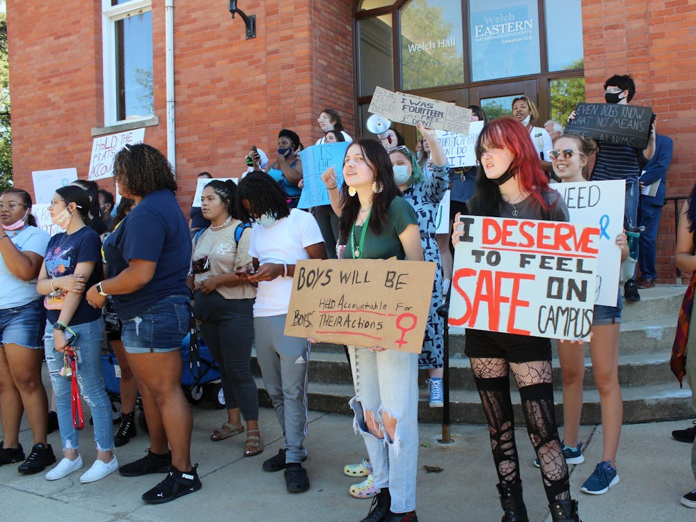 Protesters gather on the steps of Welch Hall in September 2021 after marching across the EMU campus from Pray-Harrold to demonstrate their concerns about the handling of sexual assault complaints on campus. Several Title IX lawsuits were filed against the university in the wake of former students' arrests on criminal charges.