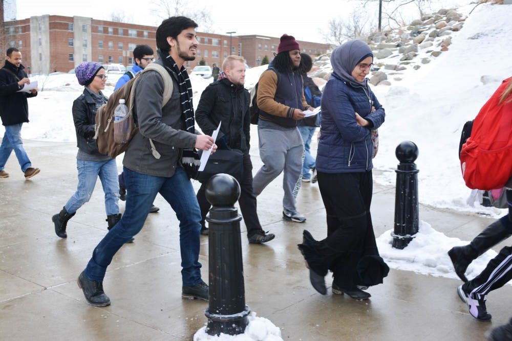 EMU students begin the second walk of the weeklong #Walkwithme protest on Feb 18, 2015 on Eastern Michigan University's campus.