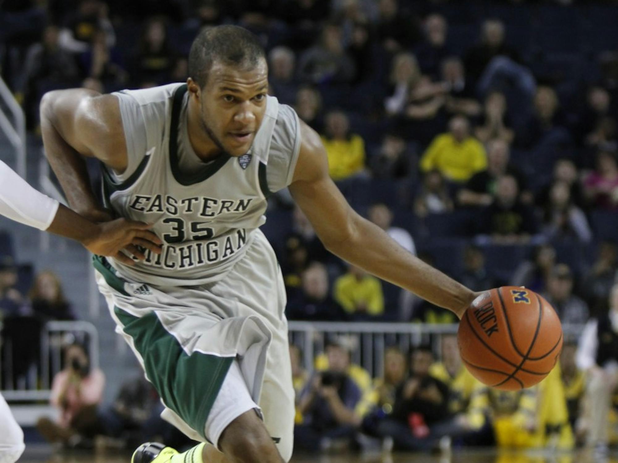 	Daylen Harrison (35) drives the ball against the University of Michigan Dec. 20, 2012.