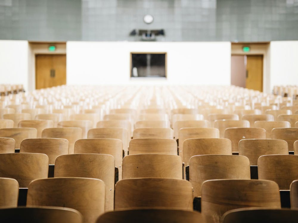 Empty chairs in an auditorium.

Photo Credit: Nathan Dumlao