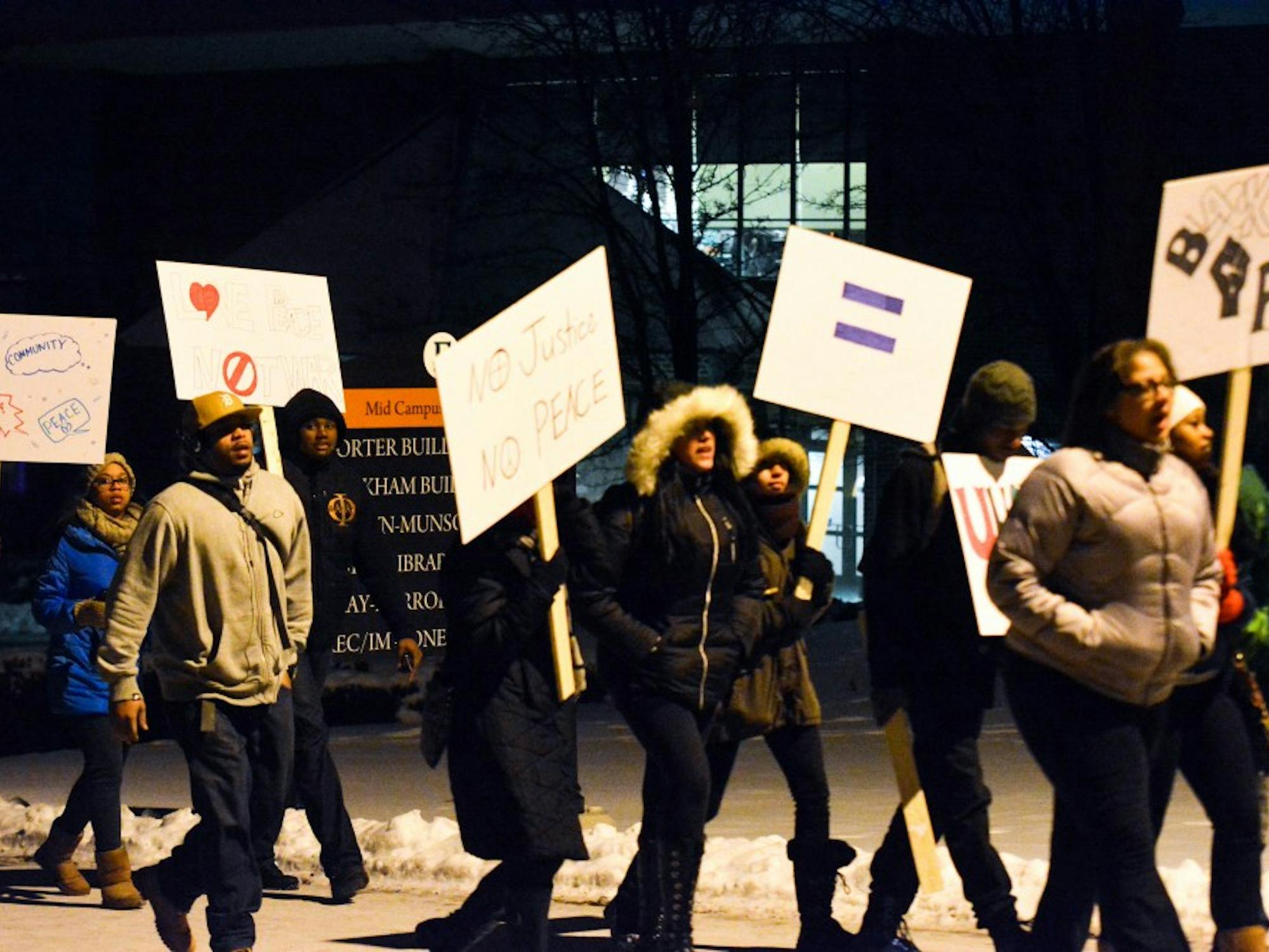 EMU students walk to important historic sites during the Martin Luter King Commemorative March on Jan 15, 2015 on Eastern Michigan University's campus.