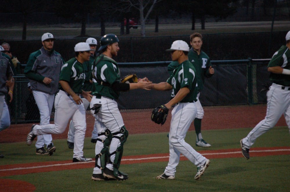 EMU catcher Adam Sonabend and pitcher Kristian Calibuso greet each other after Calibuso nailed down the Eagles’ 15-9 win versus Siena Heights Thurs. Apr. 10.