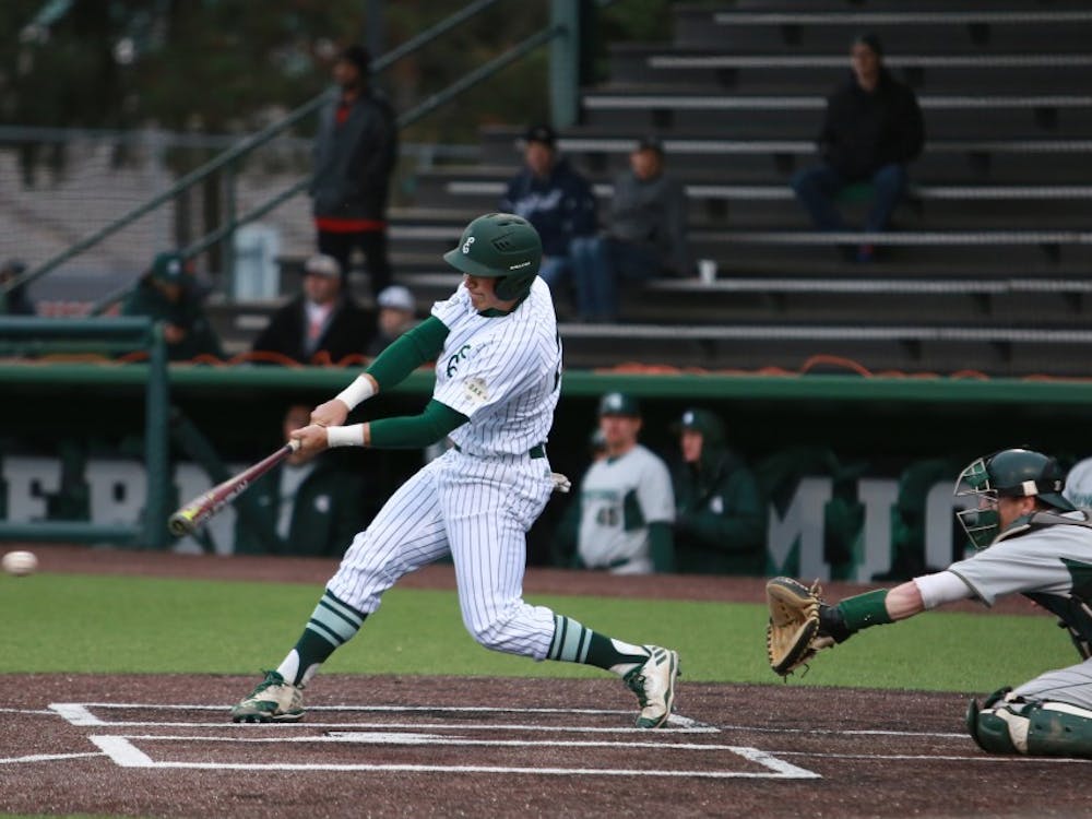 Zachary Owings hits the ball against Michigan State April 4 at Oestrike Stadium. 