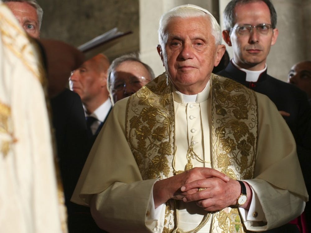 Pope Benedict XVI prays on the Stone of Anointing, where Jesus' body is said to have been prepared for burial after crucifixion, in the Church of the Holy Sepulchre in Jerusalem, Friday, May 15, 2009.